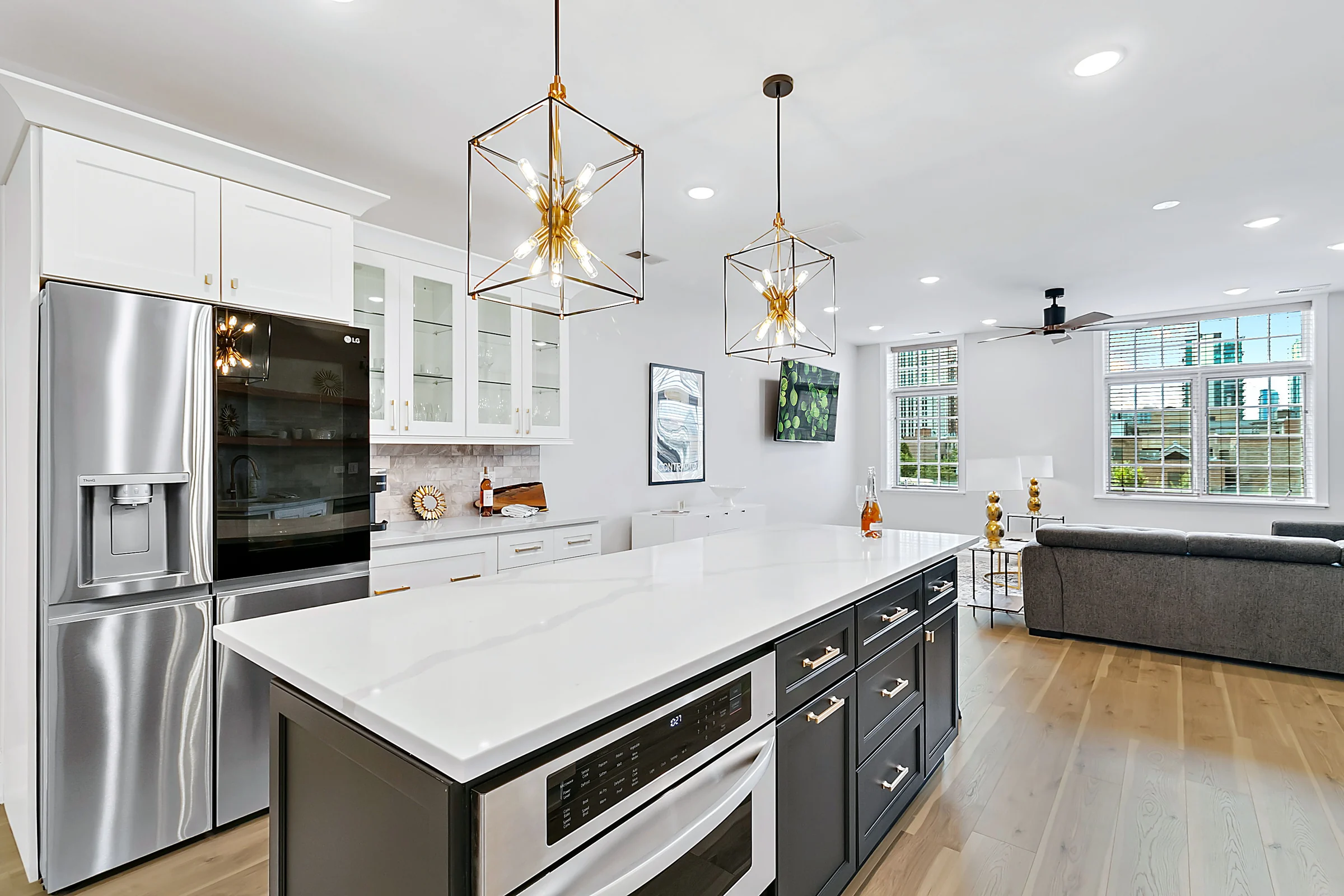 White kitchen with island and pendant lighting