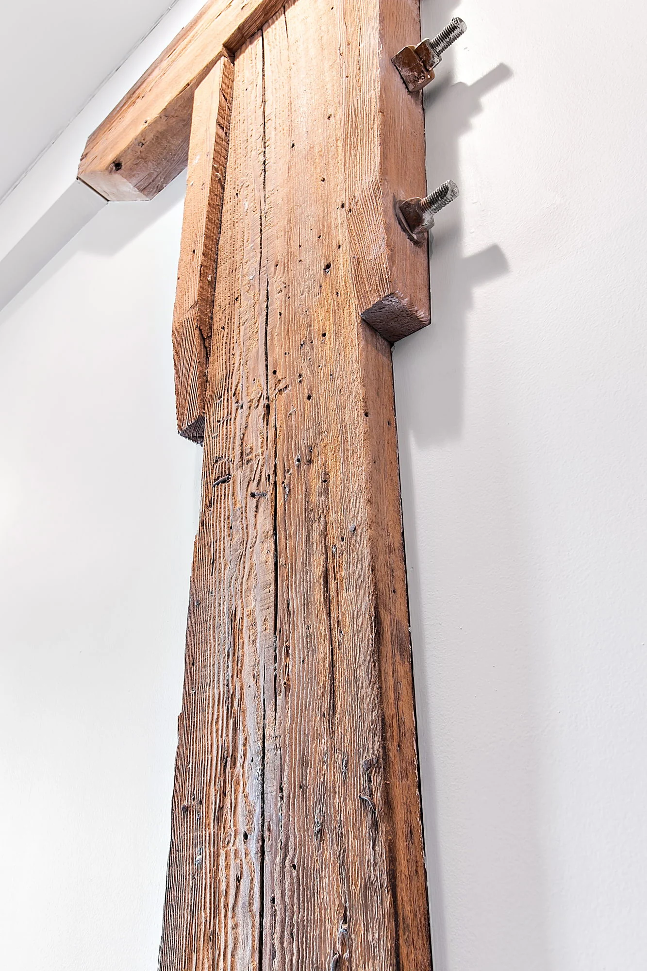 Close-up of a rustic wood sliding door and hardware