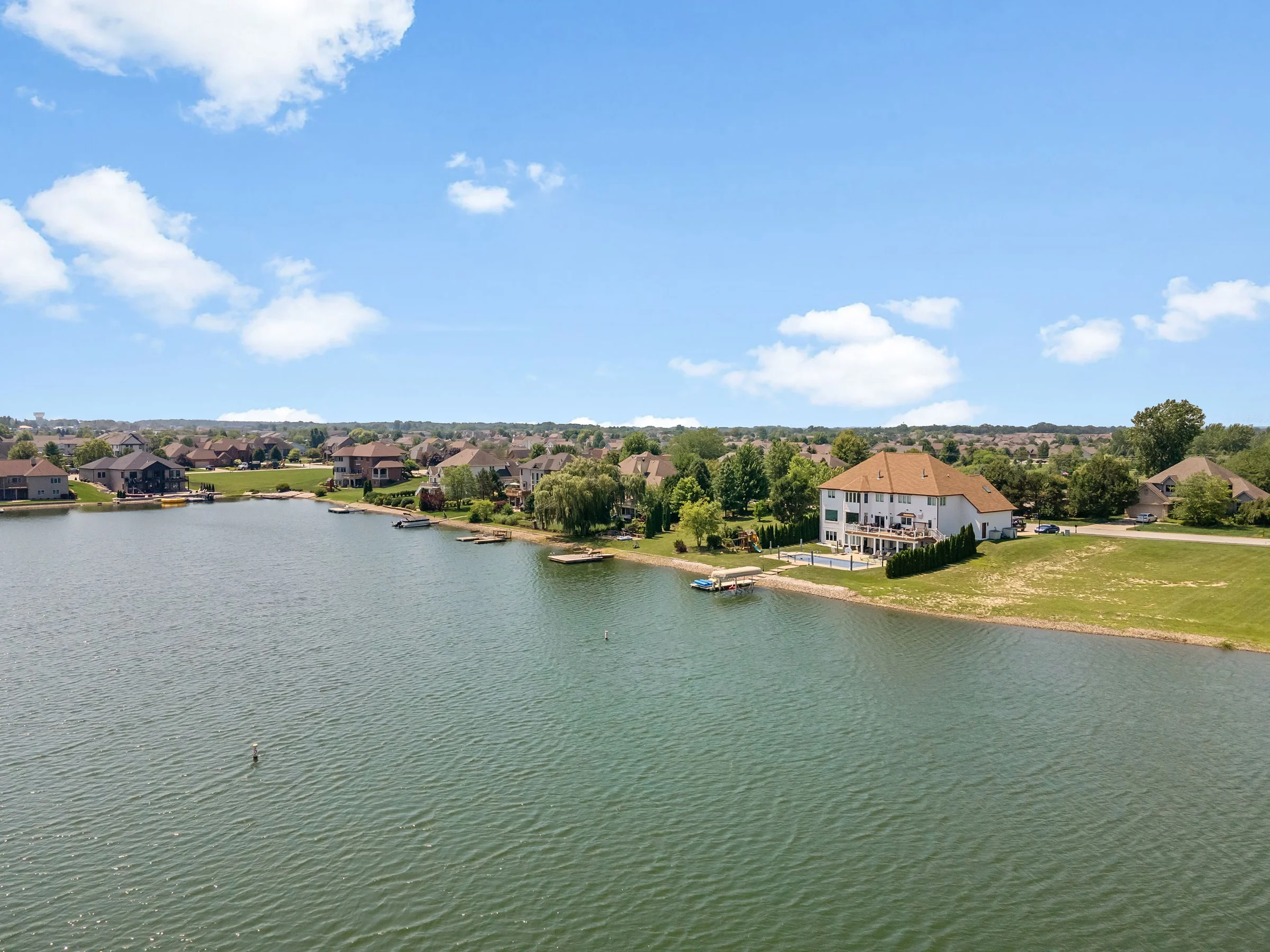Aerial view of homes along a lake